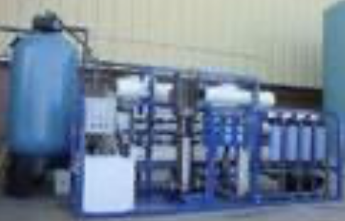 Wastewater treatment plant with treatment tanks, filters and piping for effluent and sewage treatment